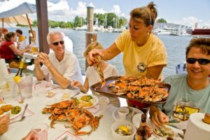 Woman serving steamed crabs