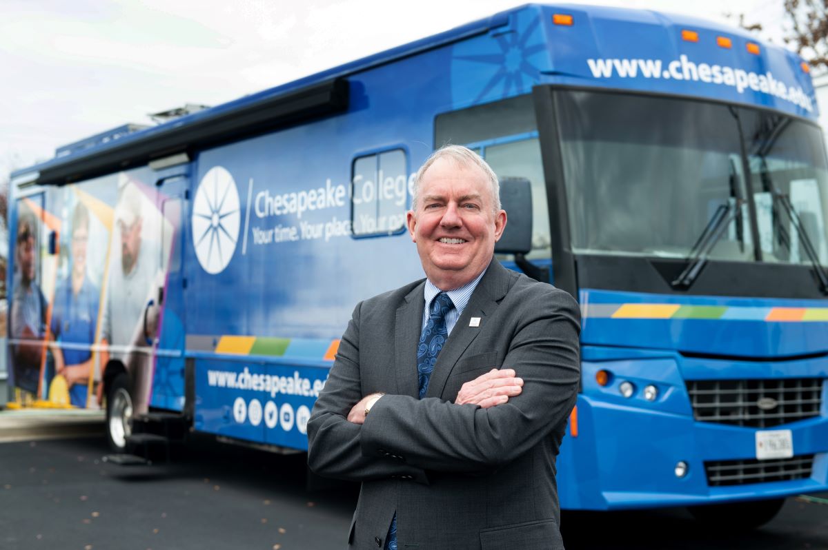 Chesapeake College President Clifford Coppersmith shown here with our truck driving simulator.